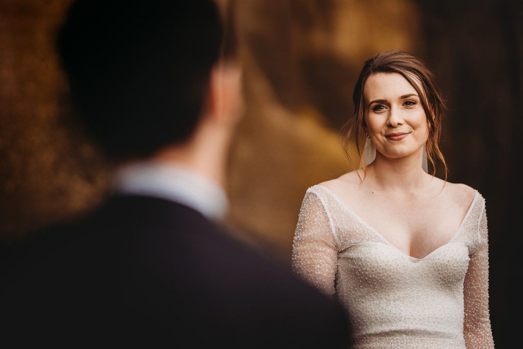 bride looking on groom - auckland wedding photography by amber farooq