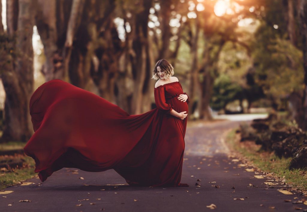 pregnant lady in red dress - - Maternity photoshoots Auckland - amber Farooq