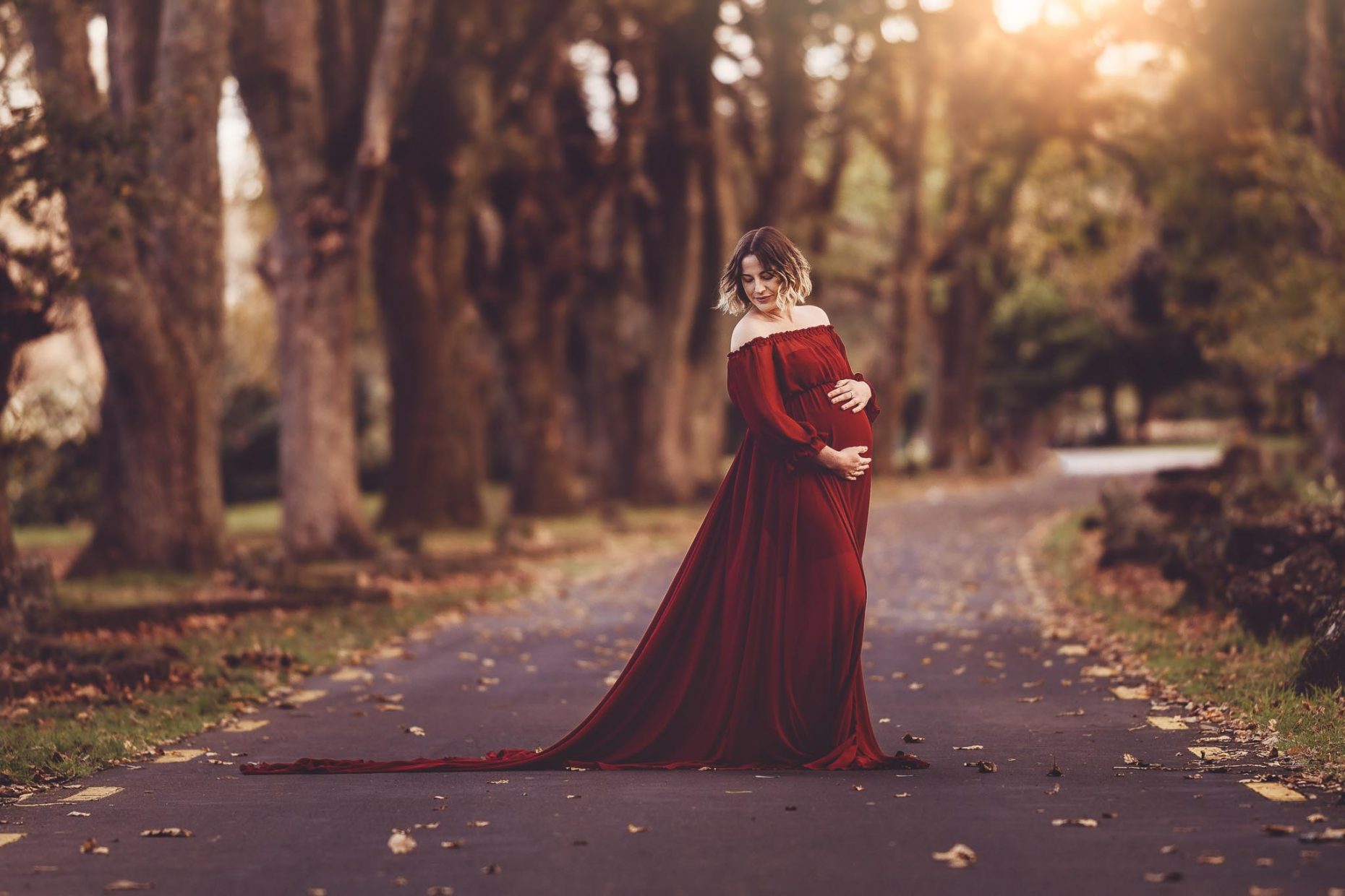 Pregnant woman in red top - Maternity photoshoots Auckland - amber Farooq