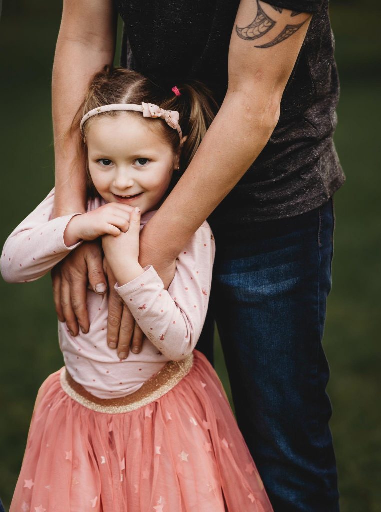 girl smiling in Auckland family photography session at Cornwall Park - Auckland family Photography