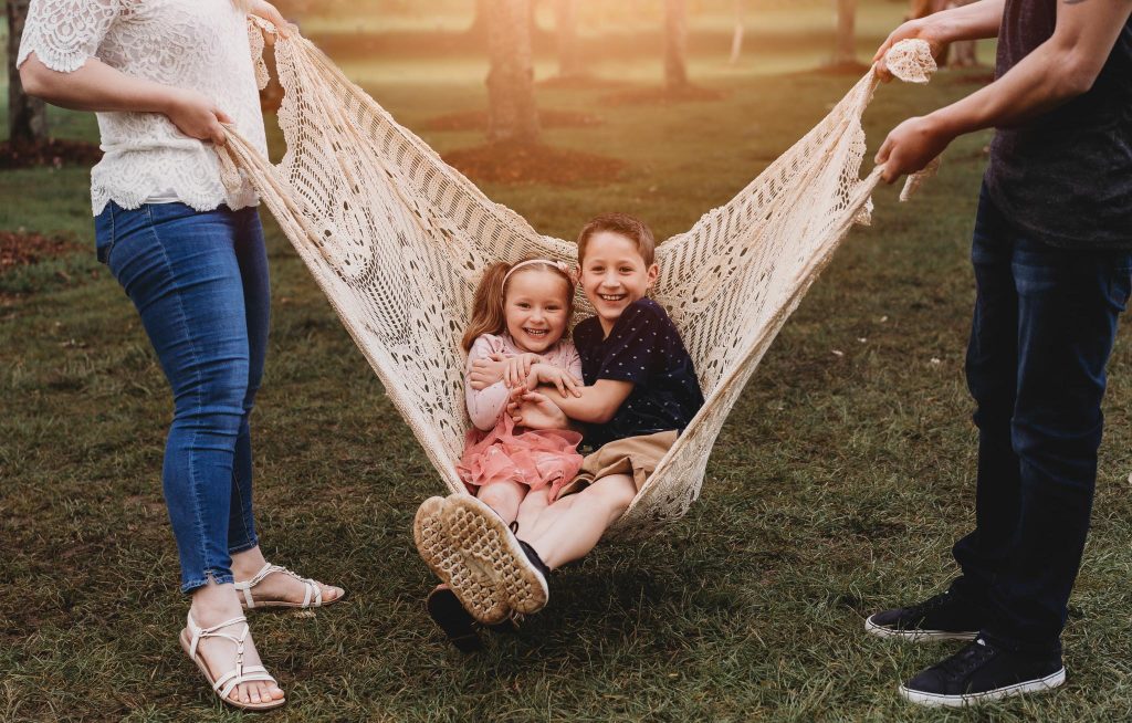 kids swinging in Auckland family photography session at Cornwall Park - Auckland Photography