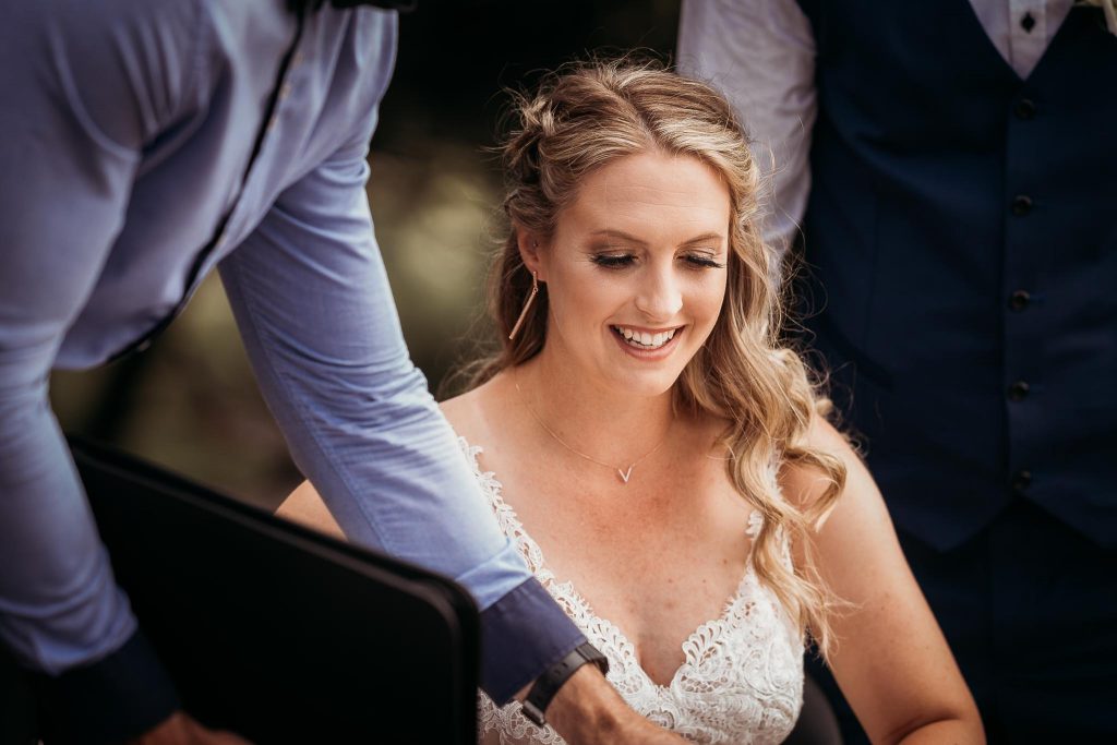 bride signing the contract in Auckland wedding - Auckland Wedding Photographer