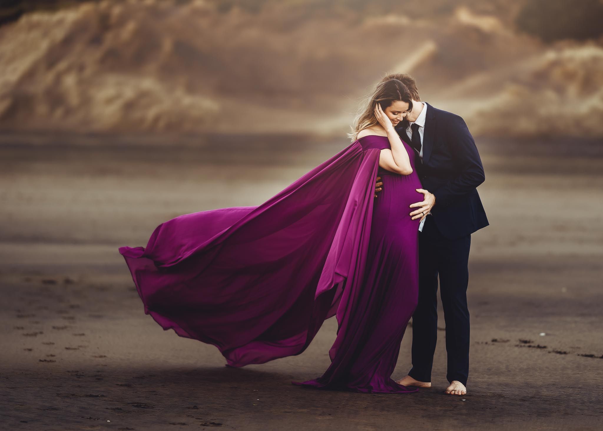 Pregnant woman smiling with husband - Auckland Maternity Photographer Amber Farooq Photography