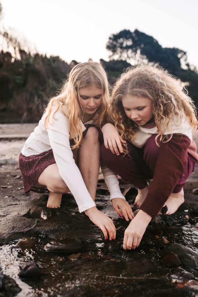 Sister sitting on the ground
