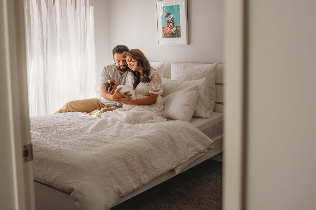 parents with newborn in room