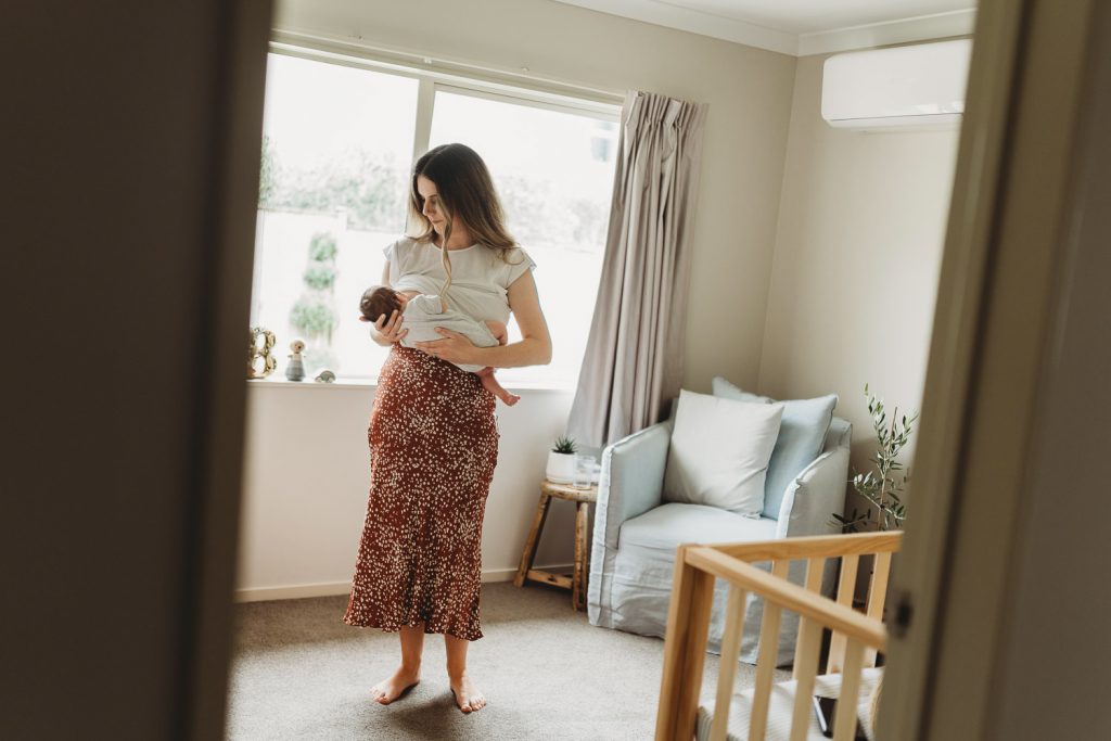 mother feeding newborn - Auckland Lifestyle Newborn Photographer Amber Farooq