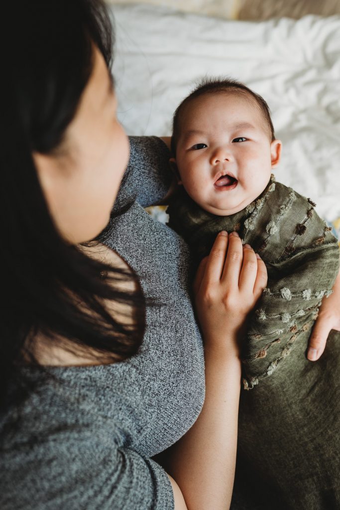 newborn looking at her mother - Auckland Lifestyle Newborn Photographer Amber Farooq