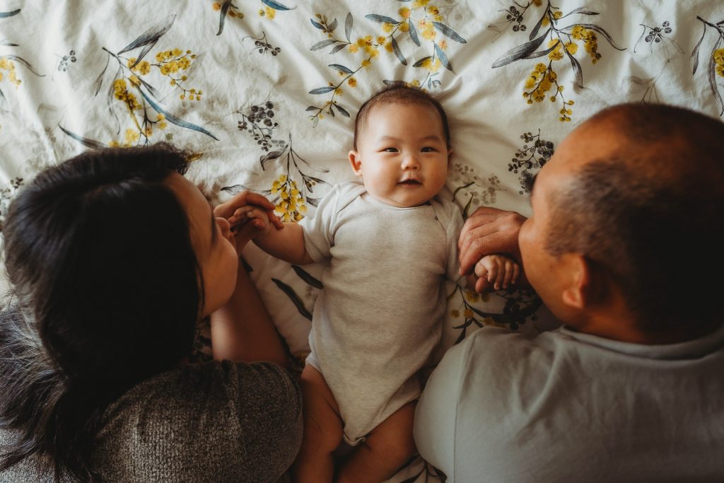 newborn playing with his parents - Auckland Lifestyle Newborn Photographer Amber Farooq