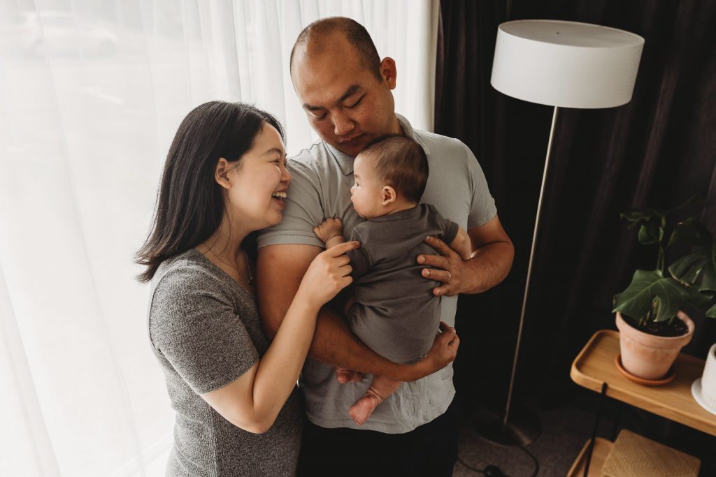 mother talking to newborn - Auckland Lifestyle Newborn Photographer Amber Farooq