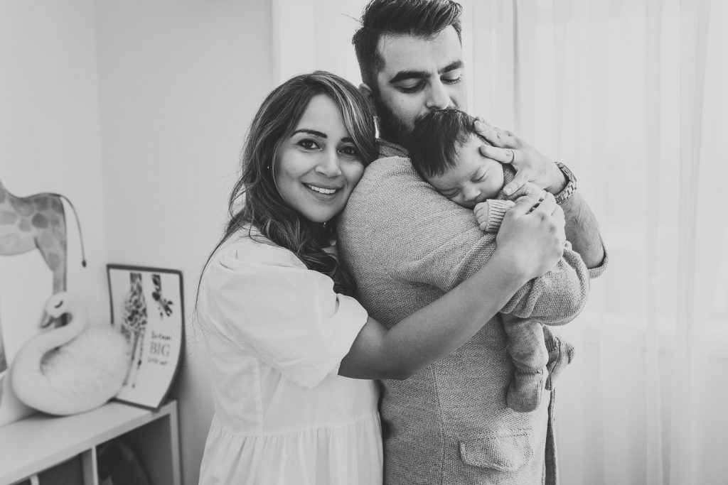 father hugging newborn - Auckland Lifestyle Newborn Photographer Amber Farooq