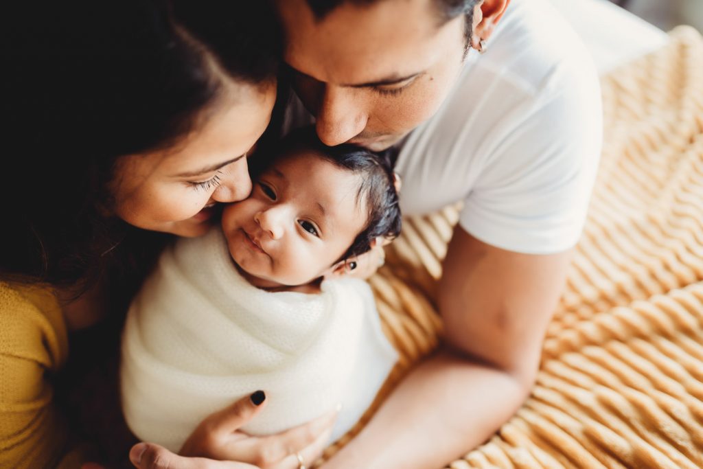 mother father and newborn - Auckland Newborn Photography Amber Farooq