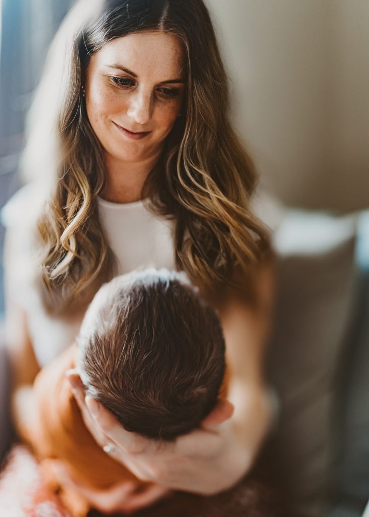 mother are looking at her newborn - Auckland Lifestyle Newborn Photographer Amber Farooq