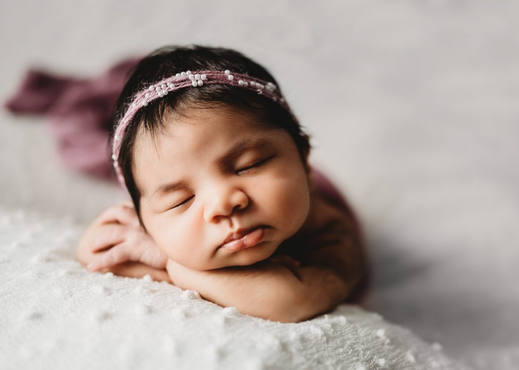 newborn sleeping in pink scarf – Auckland newborn photographer, studio sessions
