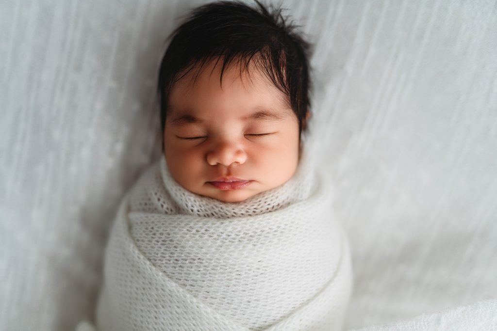 newborn and white scarf– Auckland studio newborn photography