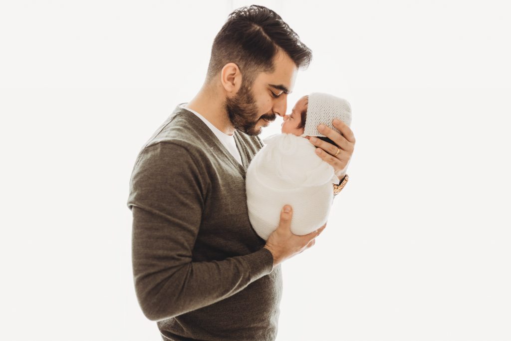 father kissing newborn – Auckland studio newborn photographer