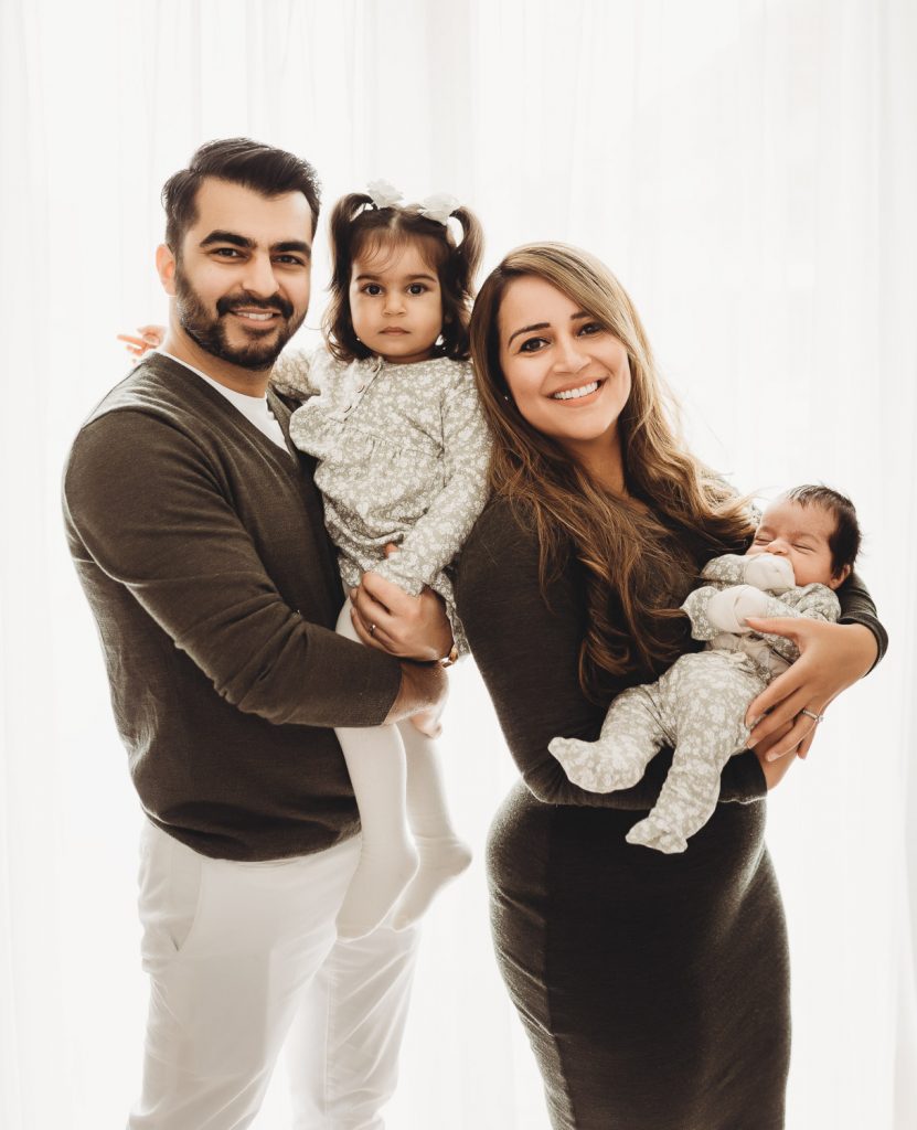 newborn and family smiling – Auckland studio newborn photographer