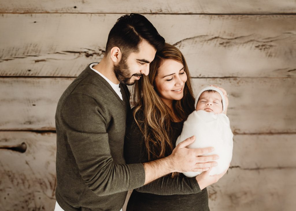 mother father looking at newborn – Auckland studio newborn photographer