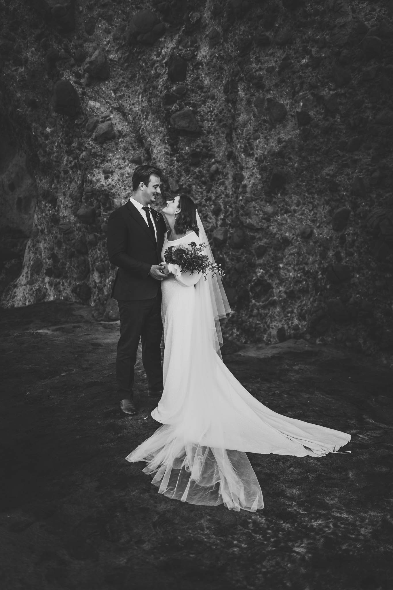 bride and groom with flowers - auckland photographer amber farooq