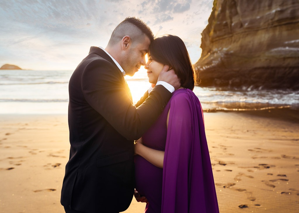 pregnant lady with husband in suit in auckland maternity photoshoot by amber farooq