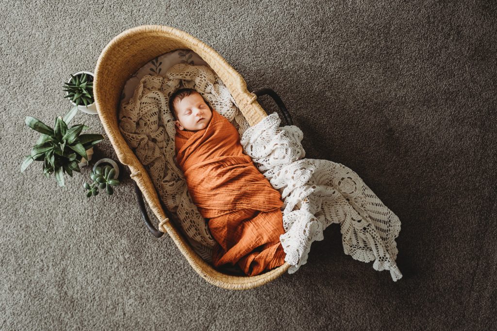 infant sleeping in crib
