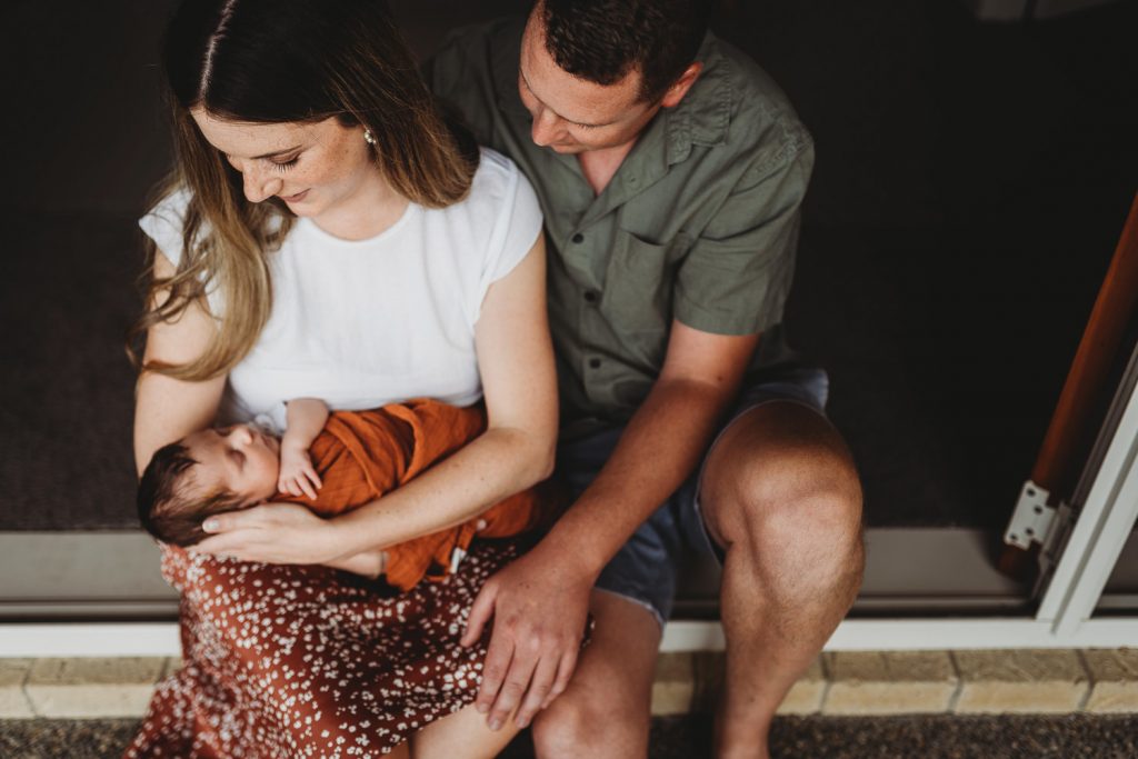 parents holding newborn hand - Auckland Newborn Photography