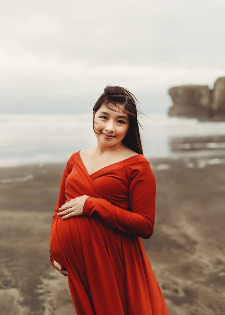 pregnant women smiling and looking into eyes during maternity photography in auckland