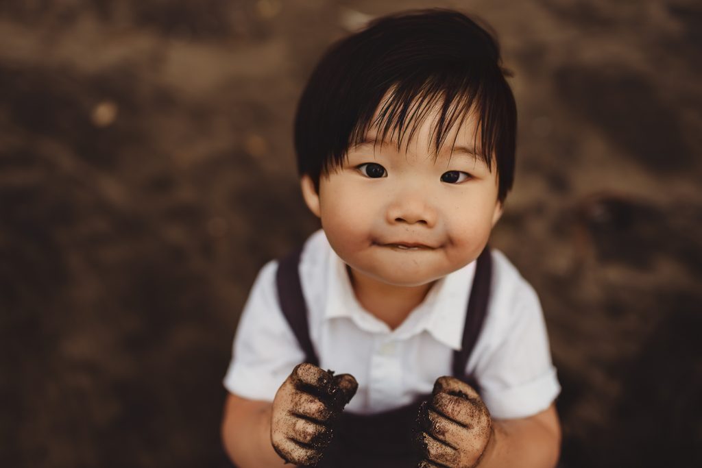 toddler smiling during maternity photography in auckland
