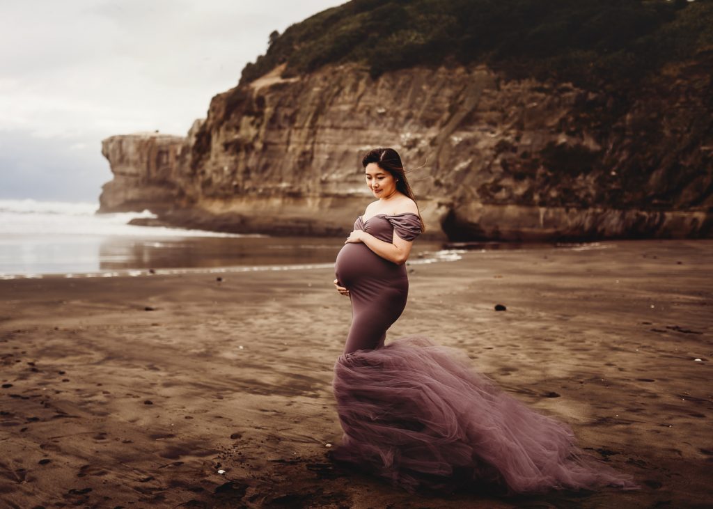 pregnant women smiling during maternity photography in auckland