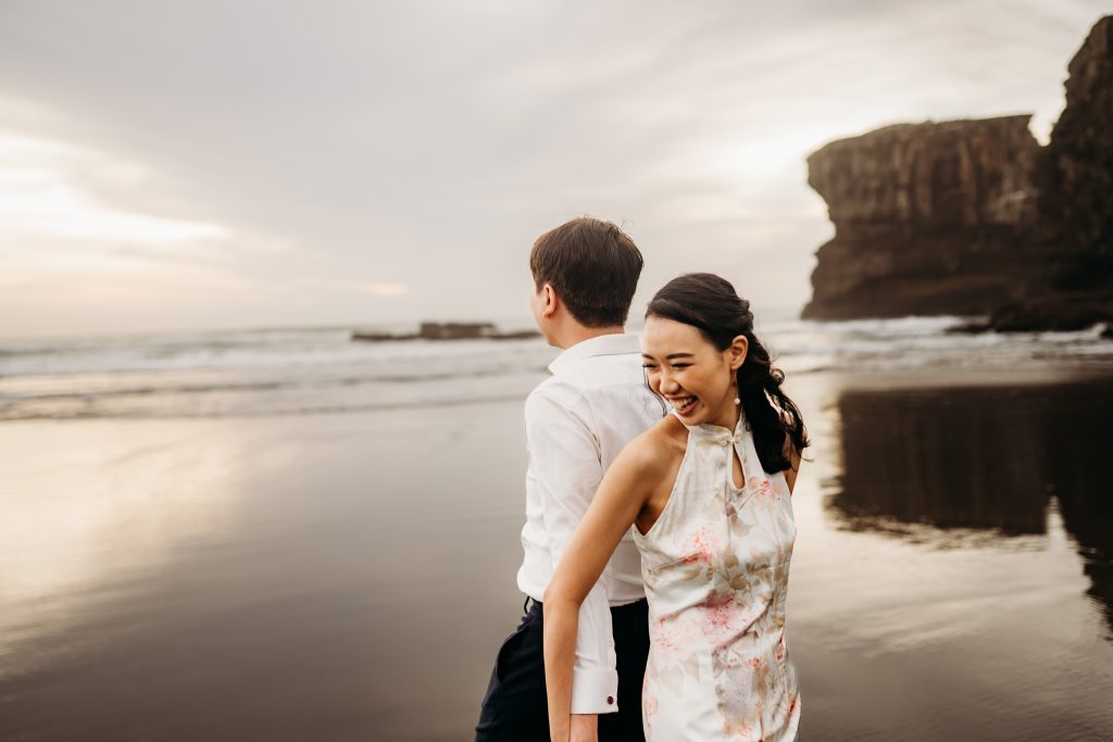 Ernest dips Lishan playfully during their honeymoon photoshoot, showcasing their lighthearted connection.
