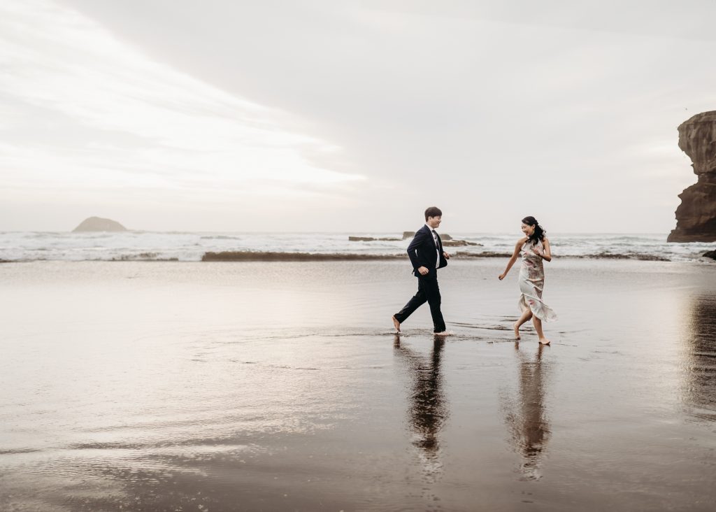 From Singapore to soulmates: Lishan and Ernest's honeymoon photoshoot captures their love story on Auckland's Muriwai Beach.
