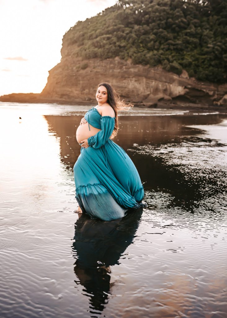 Mom and soon-to-be big sibling share a tender moment during Auckland maternity photoshoot