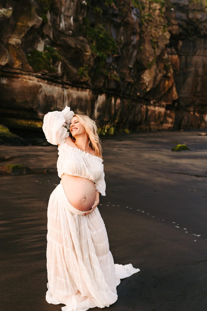 Auckland maternity photo shoot: Expecting mother surrounded by beautiful blooms, celebrating new life in Auckland.