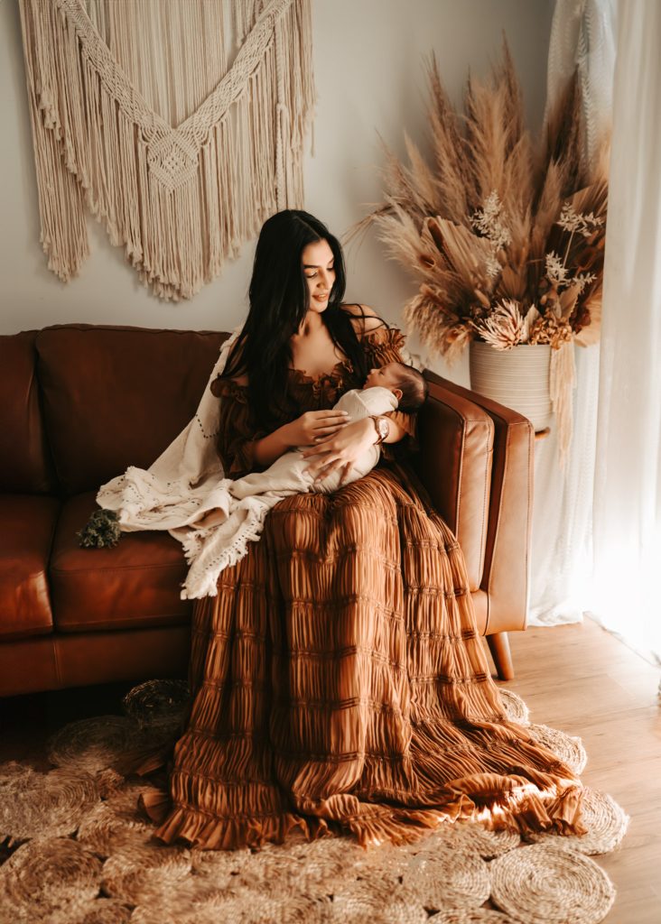 Newborn baby Arham sleeps peacefully in his crib during a lifestyle photoshoot in Auckland.