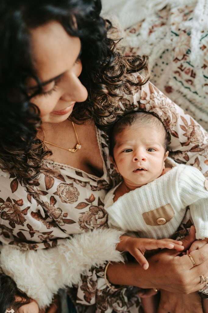 Studio newborn portraits showcase Niam's tiny features and peaceful expressions, bathed in the warmth of the studio lights.