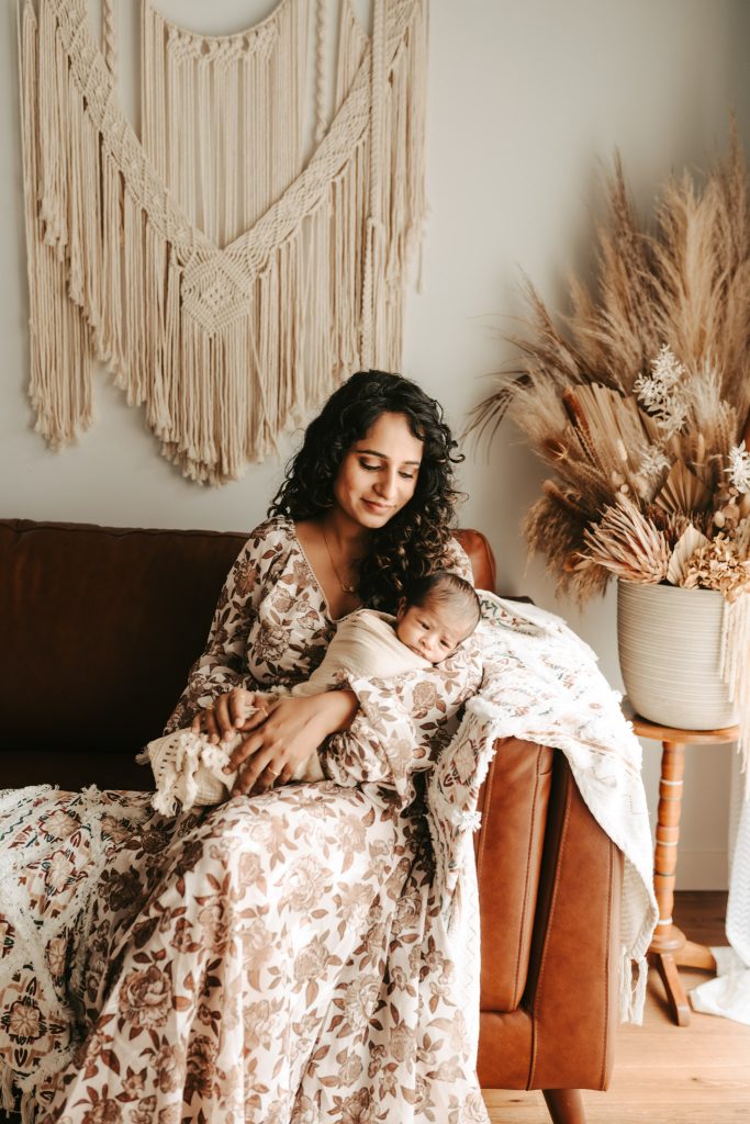 Skilled newborn photographer in Auckland: Studio session ensures a safe and comfortable experience for baby Niam.